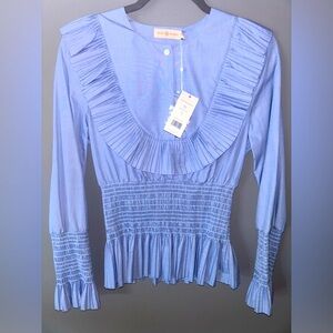 Tory Burch blue ruffle on front and back, peplum waist. NWT, size 4.
